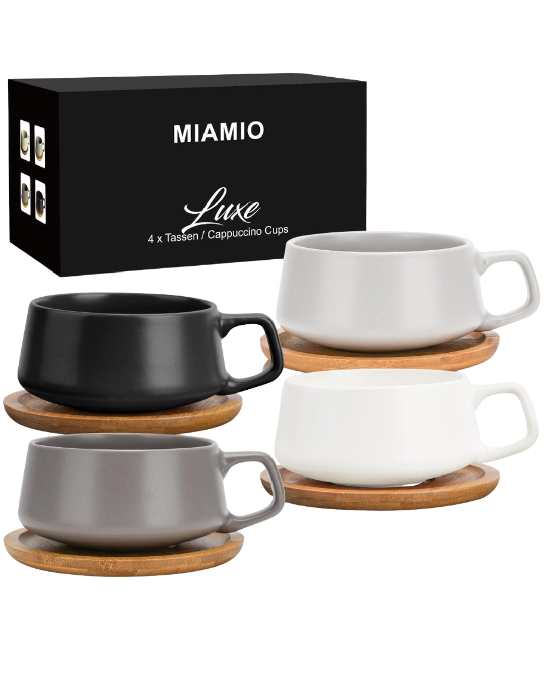 Tassenset aus vier Tassen in den Farbtönen schwarz, weiß und grau. Mit Untersetzern.